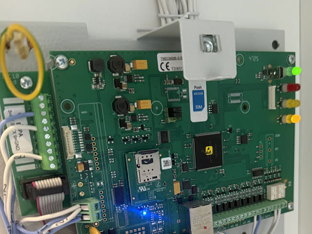 A fire-alarm transmitter board with its own SIM card, fitted by FlatTurtle