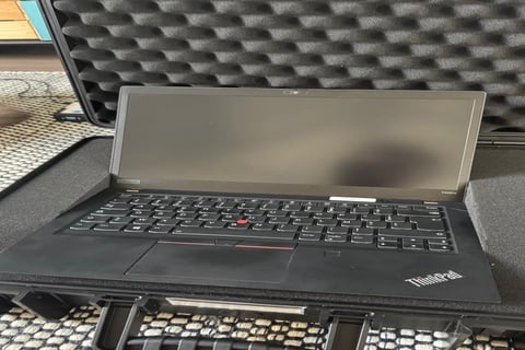 A laptop prepared by FlatTurtle in a foam-lined flight case